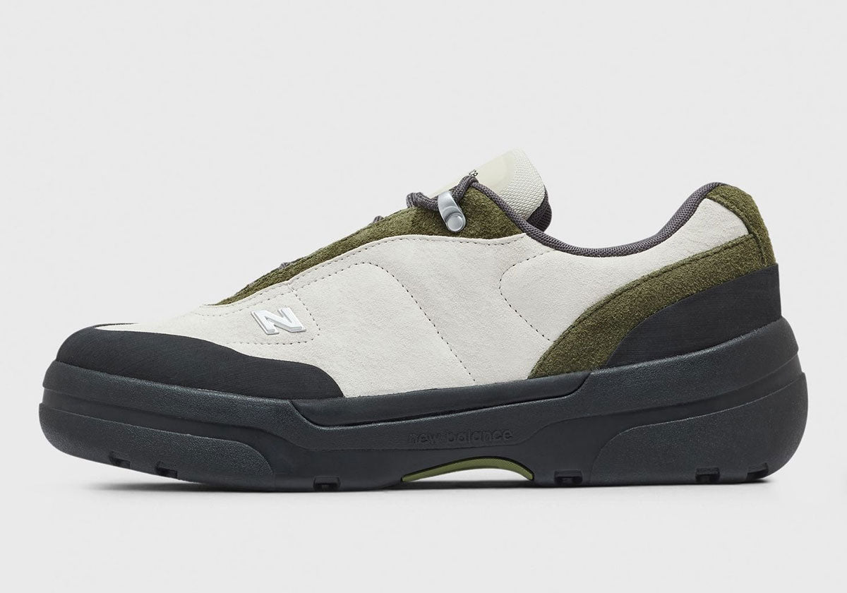 New Balance TL900 Army Green UTL909QQ in off-white and olive suede, lateral side view. Image via Sneaker News
