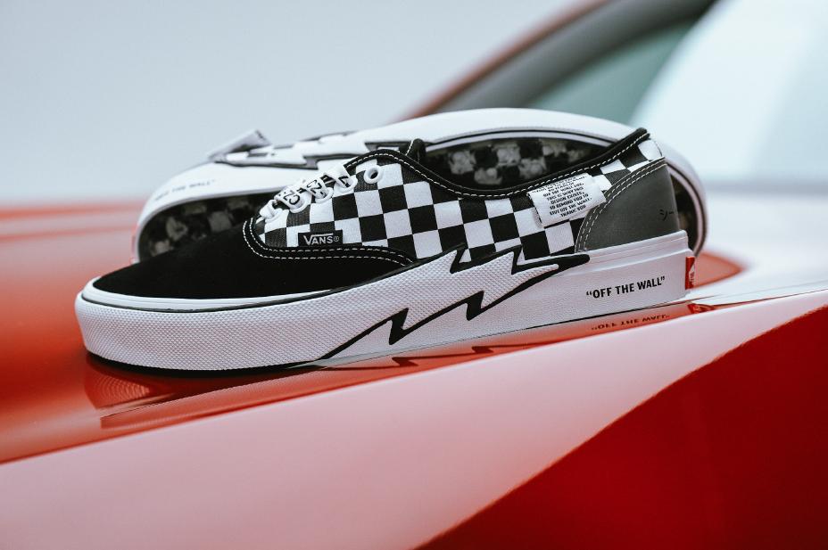 Vans x Coco Zurita Authentic in black-and-white checkerboard with lightning-bolt bumper, sitting on the red Acura ADX CZ-77 Concept. Photo courtesy Acura