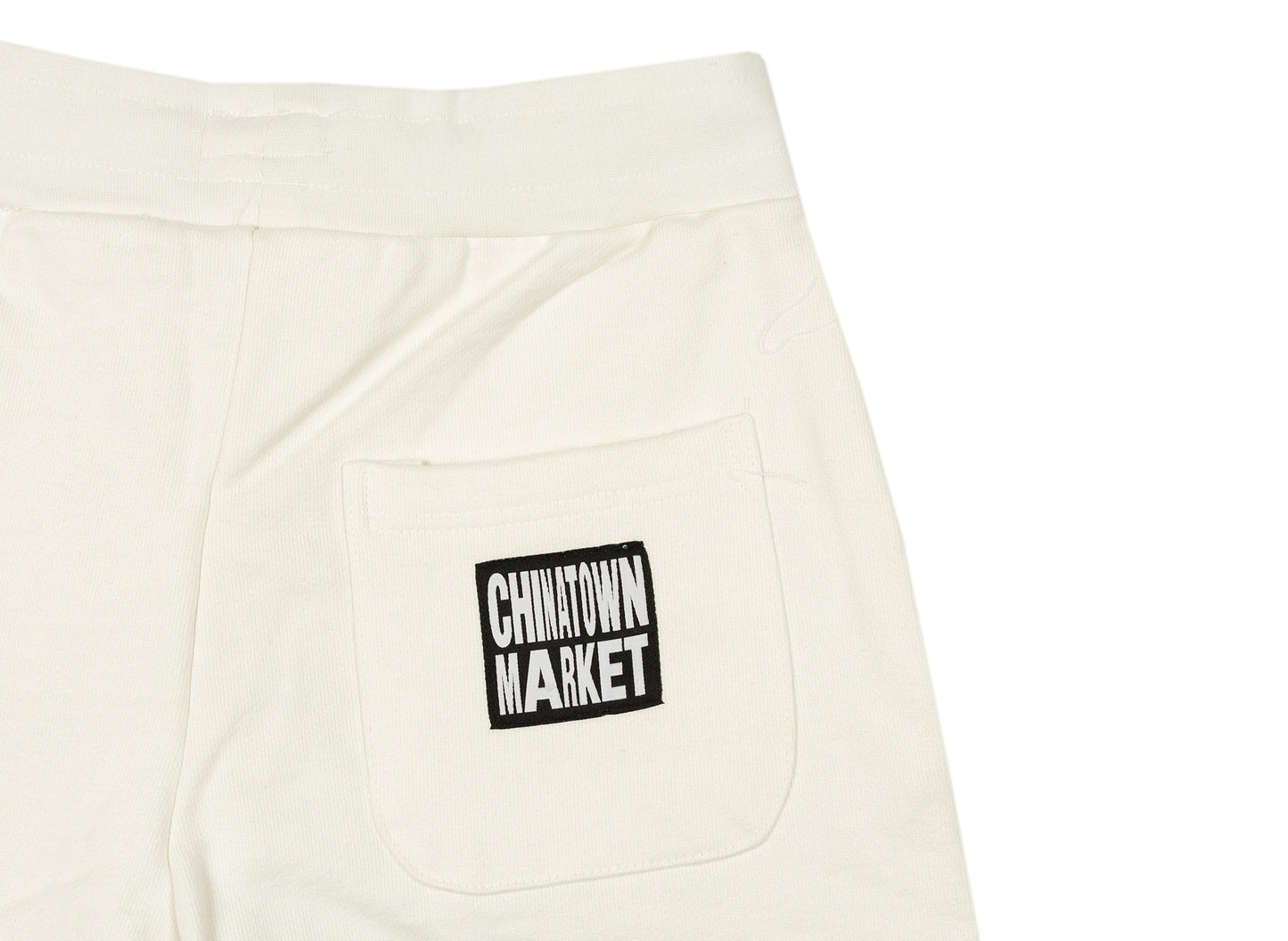 Pantalones cortos de chándal Chinatown Market Skelly World Tour en color crema
