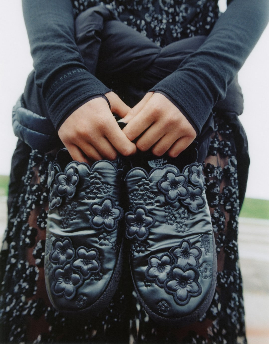 The North Face x Cecilie Bahnsen Angela ThermoBall Mule in black with raised floral quilting, FW26 campaign image via Fullress