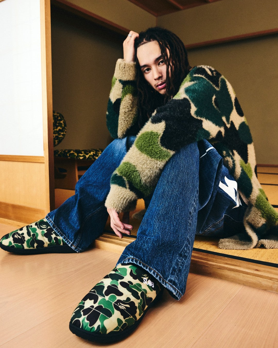 A BATHING APE x SUBU Puffer Sandals in green ABC CAMO. Image via Fullress
