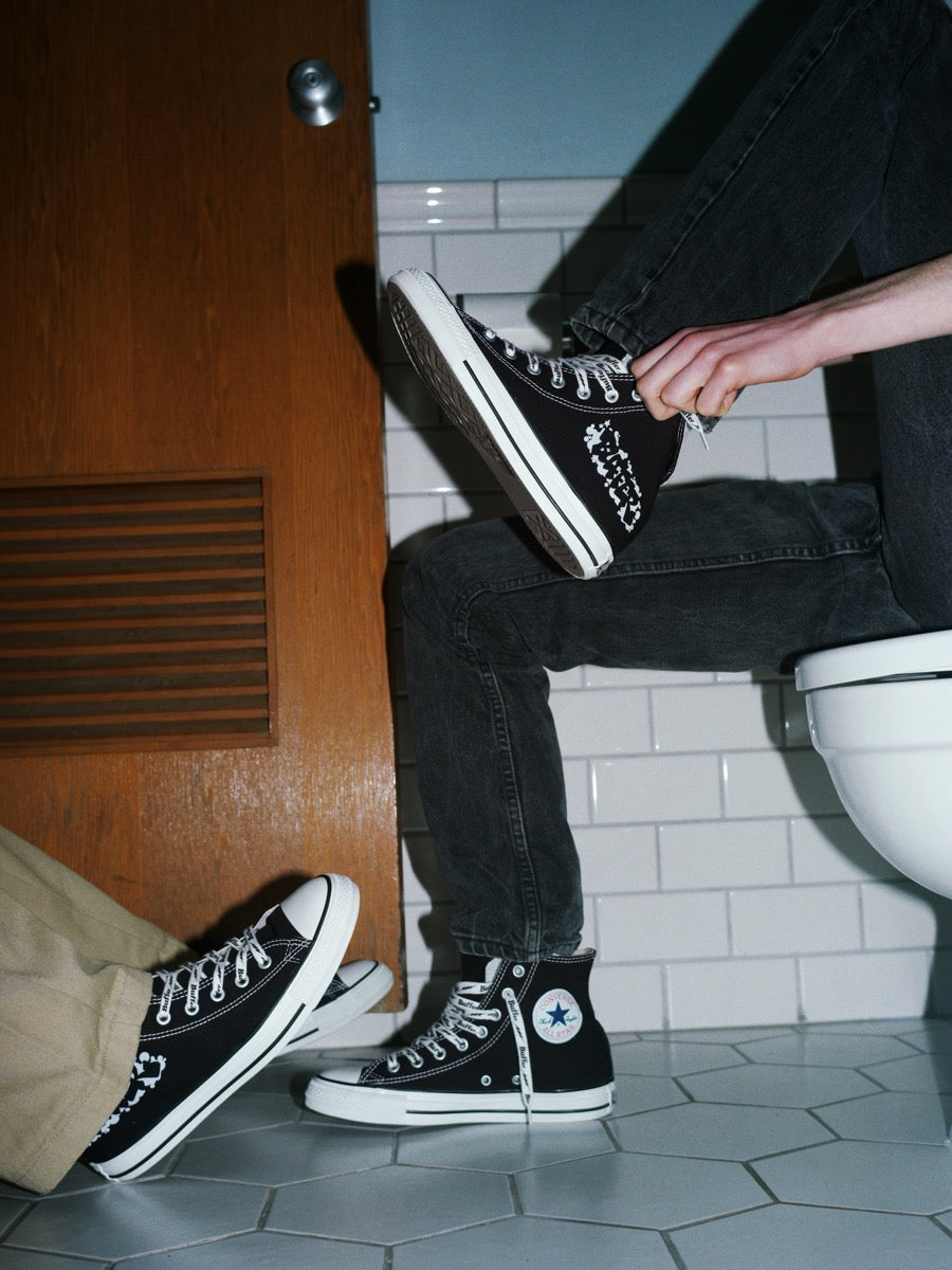 Buffer x Converse All Star Hi BOMBING campaign — black hi-tops on-model bathroom lookbook