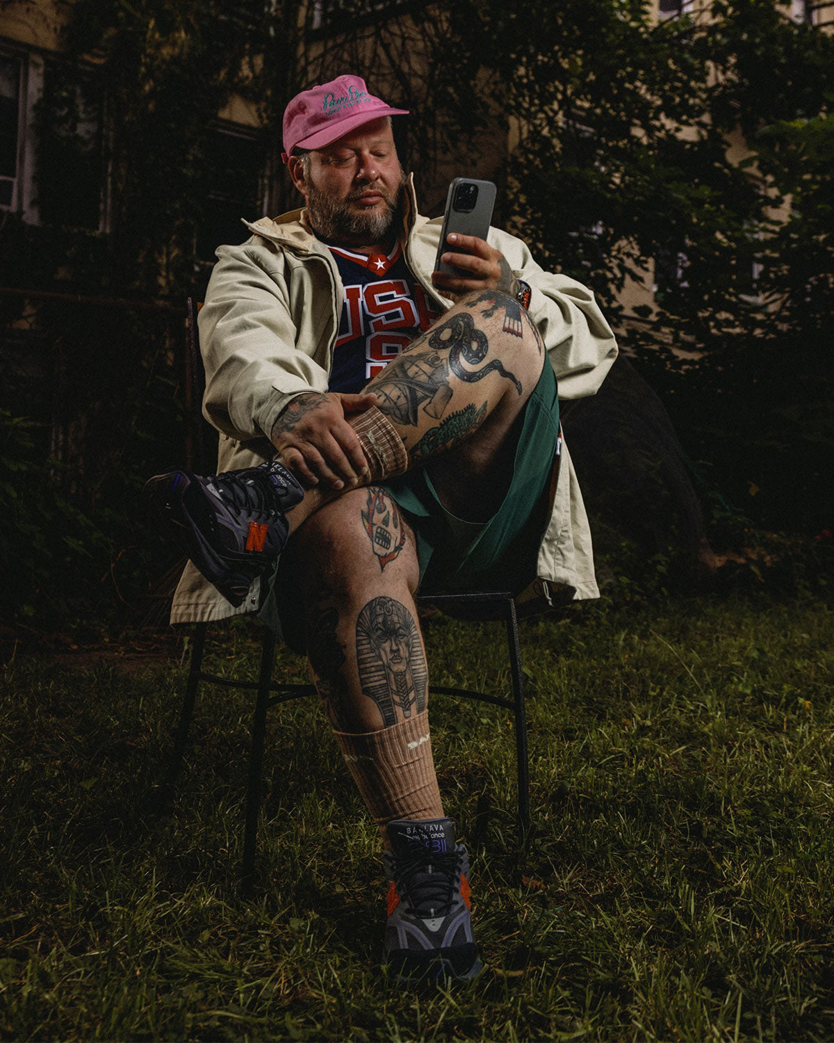 Action Bronson seated outdoors in Baklava kit wearing New Balance 2811 “Blackjacques,” official campaign