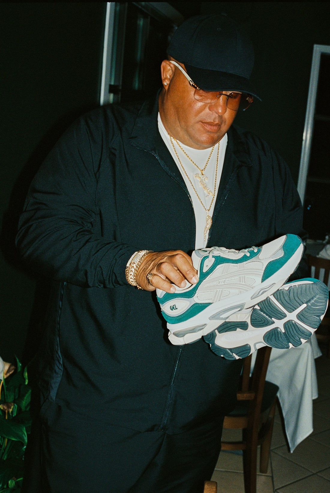 Lapstone & Hammer × ASICS GEL-NYC 2.0 GEL-PHL — lifestyle campaign, shoes in hand