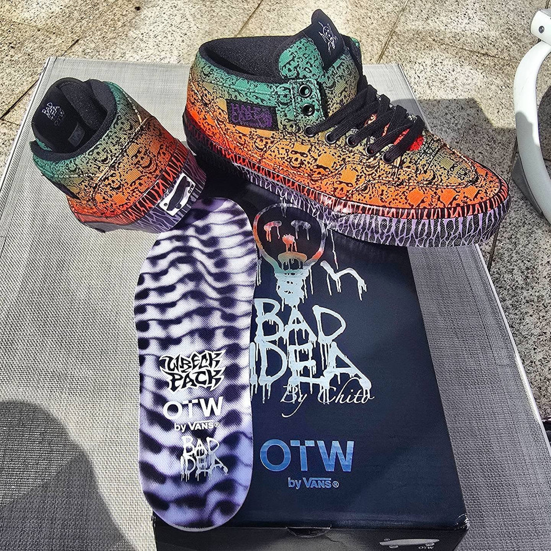 Chito / Bad Idea × Vans OTW Half Cab 33 Halloween — outdoor packshot on mesh chair