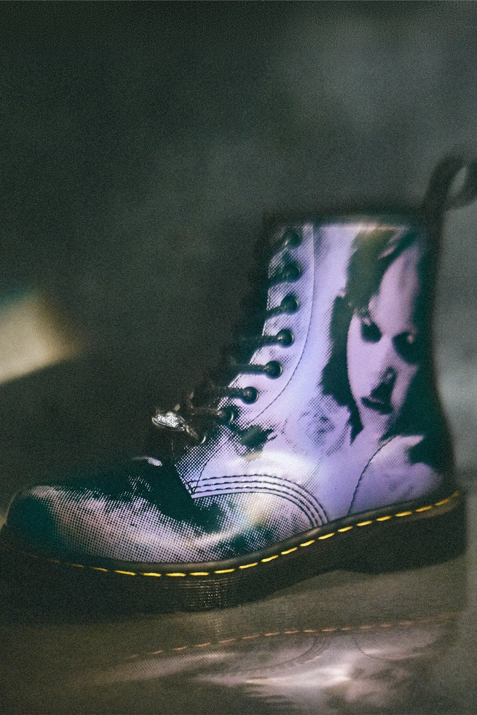 Dr. Martens x The Exorcist 1460 boot in Black/Purple with Regan MacNeil print, image via Hypebeast