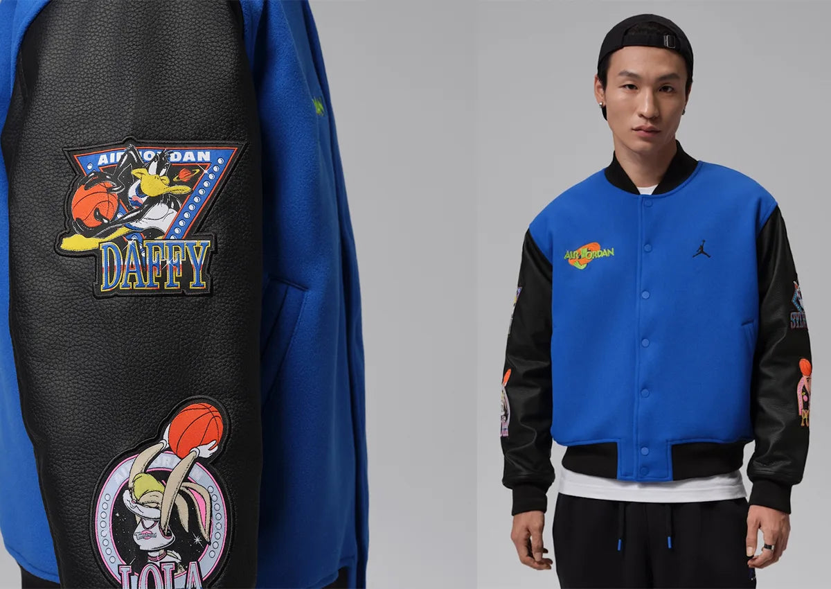 Jordan Flight Space Jam Varsity Jacket Varsity Royal/Black IX3095-497 with Daffy Duck and Lola Bunny sleeve patches. Image via JustFreshKicks