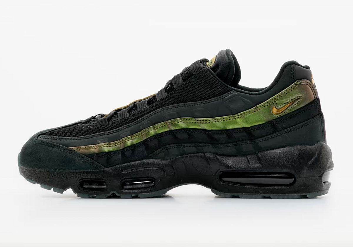 Kyle Wilson x Nike SB Air Max 95 HF7545-003, side profile in black and grey with metallic bronze stripe. Photo via Sneaker News