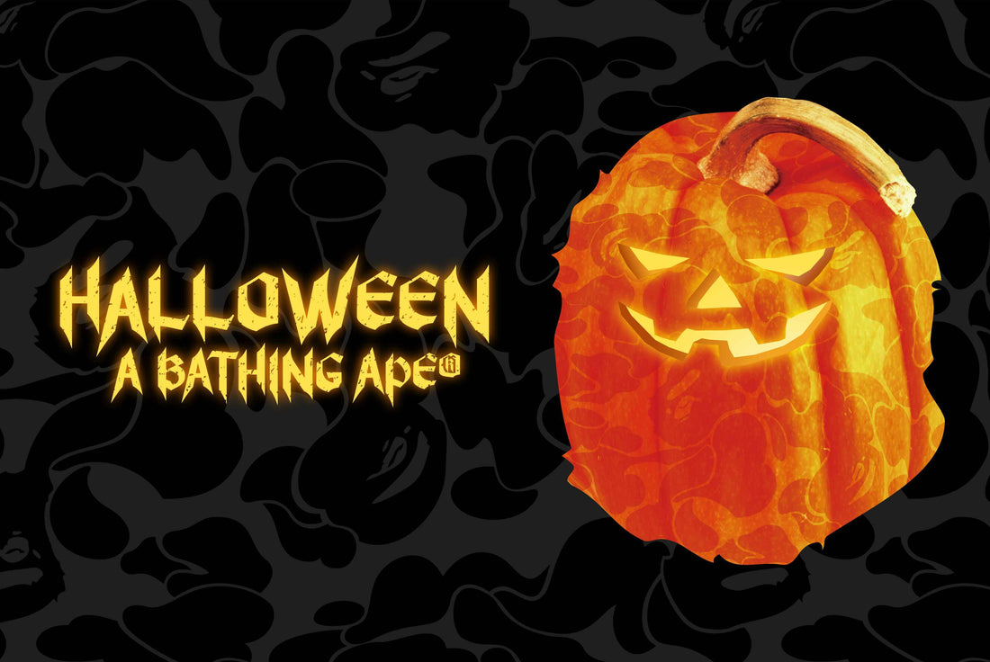 A glowing jack-o'-lantern made from orange BAPE camo next to the words Halloween A Bathing Ape on a black camo background — official BAPE campaign image