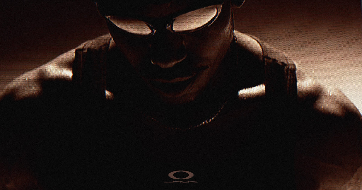 Cactus Jack x Oakley campaign still — on-model wrap sunglasses — official Travis Scott / Oakley