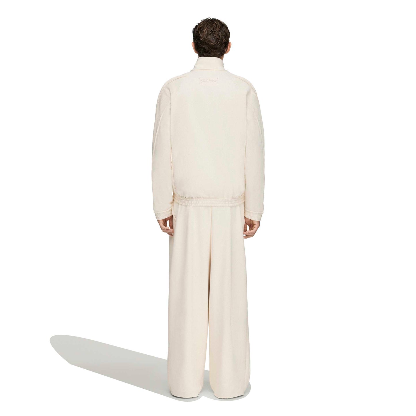 Adidas x Tyrrell Winston Stadium Track Pant in Wonder White – on model back