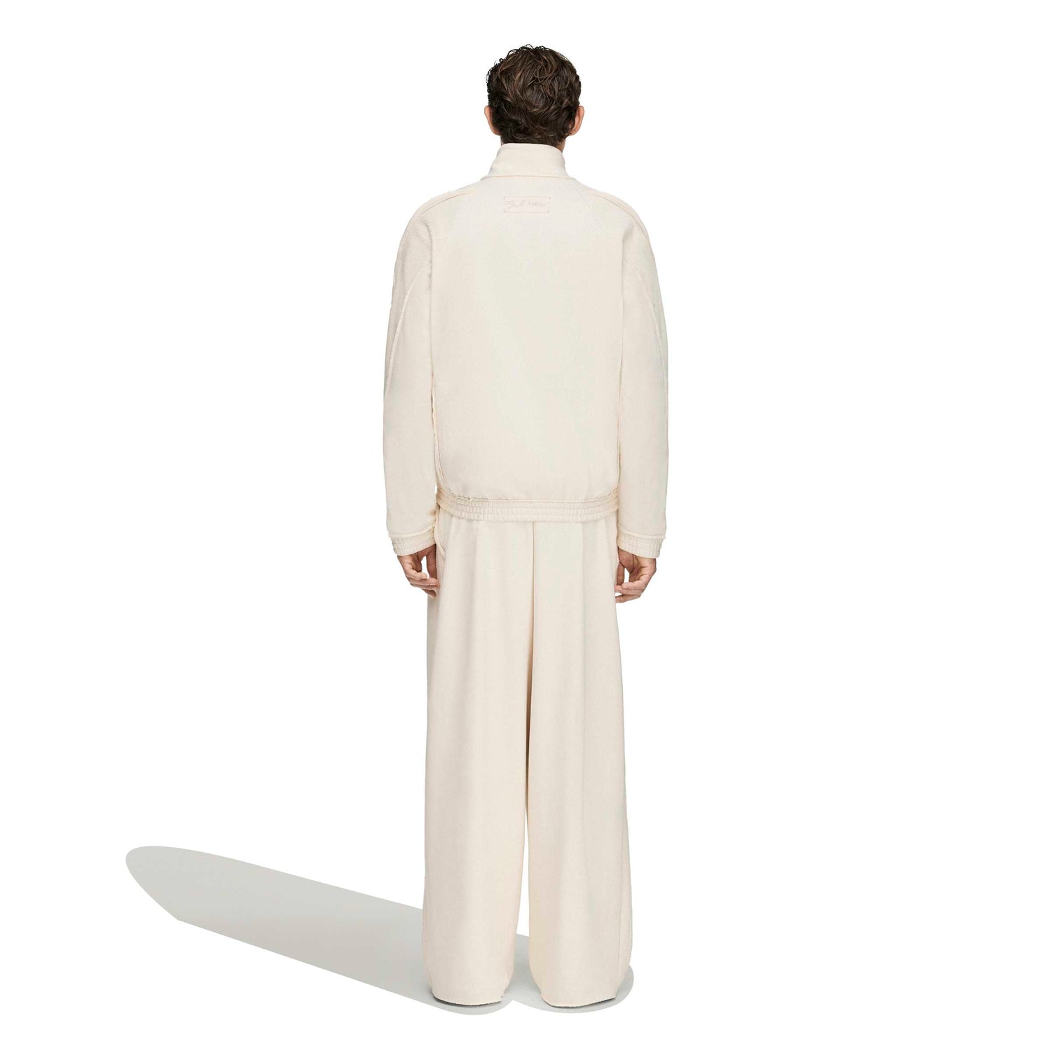 Adidas x Tyrrell Winston Stadium Track Pant in Wonder White – on model back