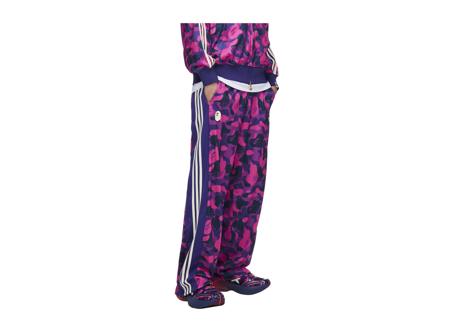 Adidas x BAPE Reversible Adibreak Pants in Collegiate Purple — on model three quarter view