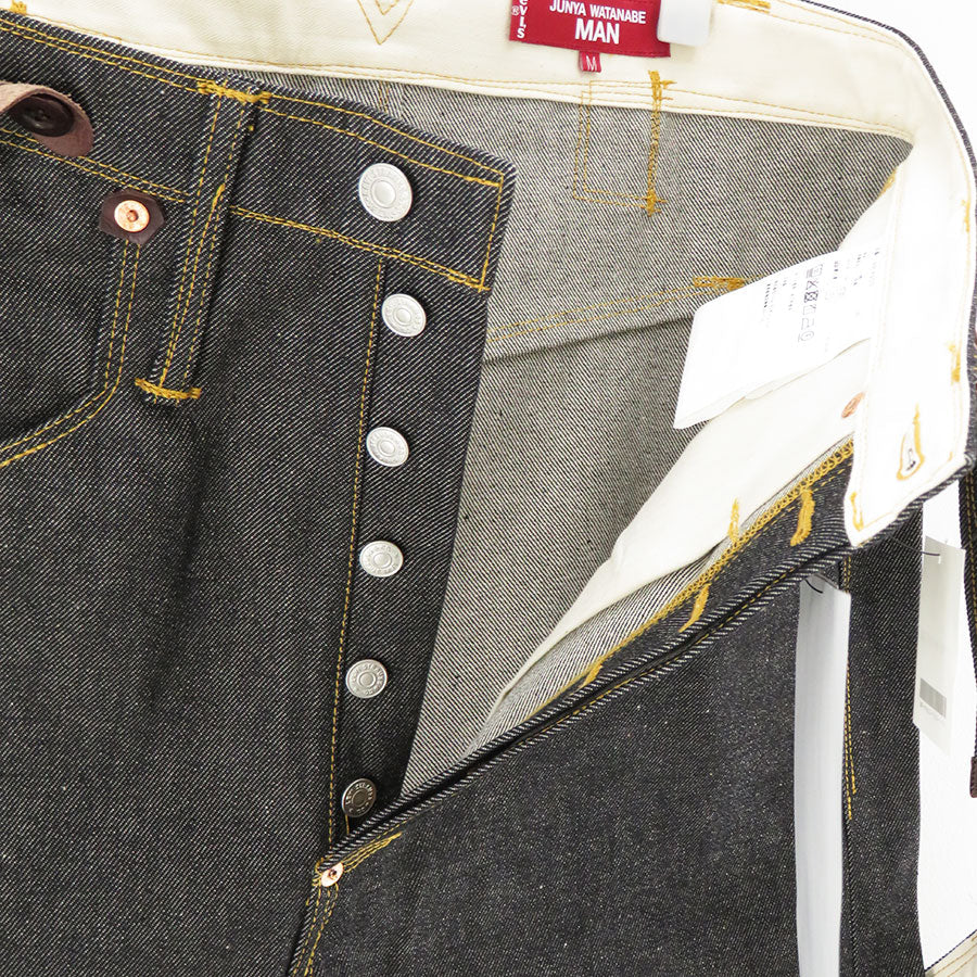 Junya Watanabe MAN x Levi's suspenders denim pants in black button-fly detail