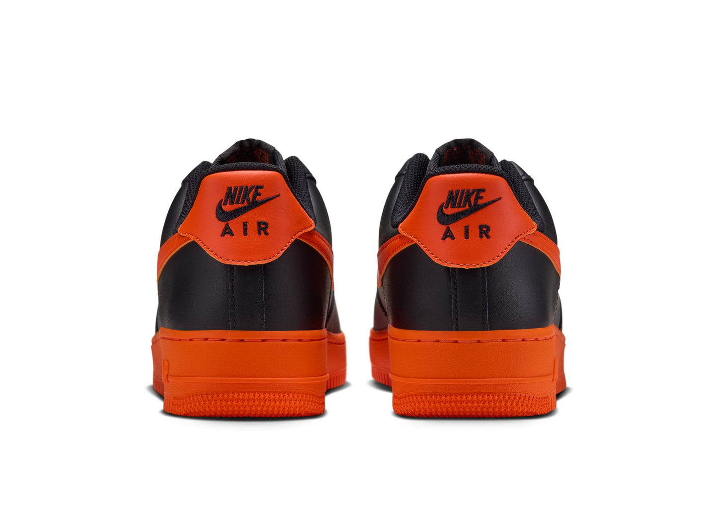 Nike Air Force 1 '07 in Black / Safety Orange — rear view of the pair
