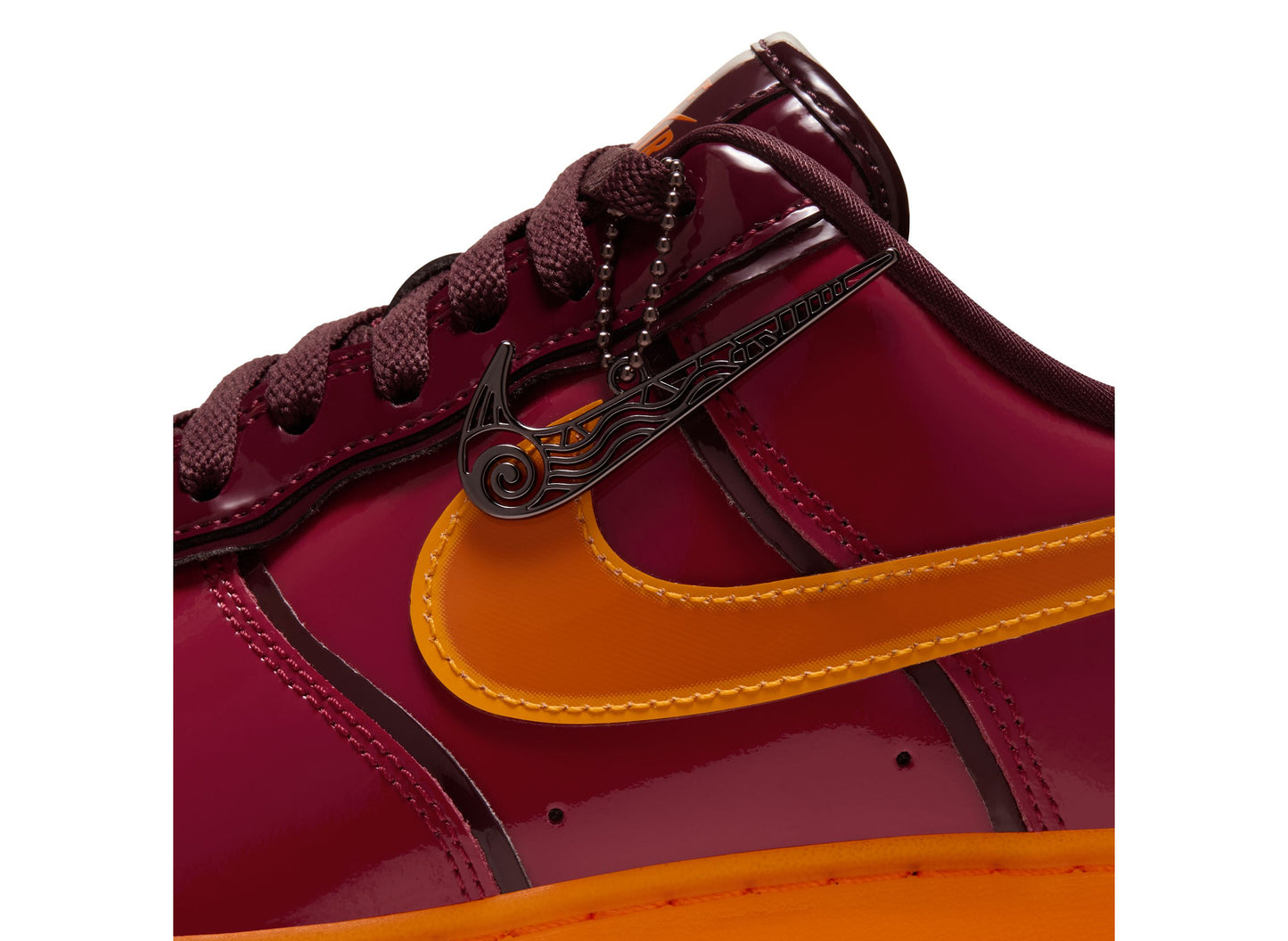 Nike Air Force 1 07 Premium in Gym Red / Bright Ceramic — pendant detail