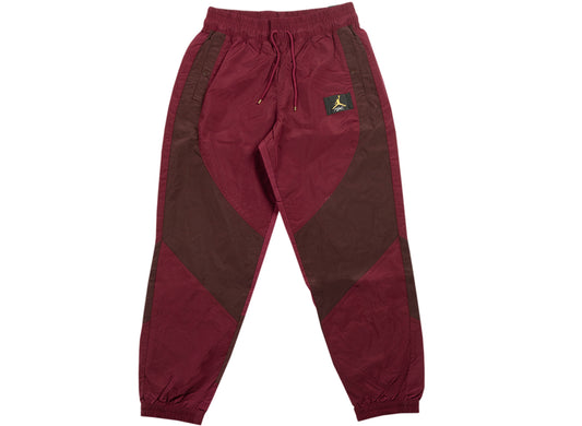 Women's Jordan Woven Pants in Dark Beetroot / Mahogany