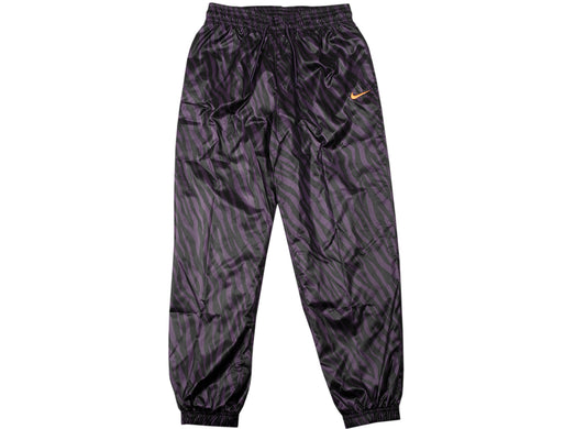 Women's Nike Sportswear Icon Clash Woven Pants in Dark Raisin / Bright Mango